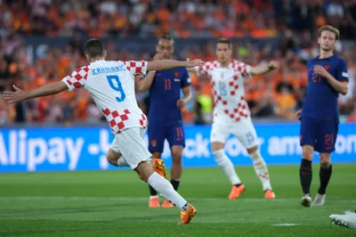Croatia's Andrej Kramaric celebrates after scoring from penalty against Netherlands during the Nations League semifinal soccer match between the Netherlands and Croatia at De Kuip stadium in Rotterdam, Netherlands, Wednesday, June 14, 2023. (AP Photo/Patrick Post)