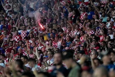 Croatia fans cheer on the stands during the Nations League semifinal soccer match between the Netherlands and Croatia at De Kuip stadium in Rotterdam, Netherlands, Wednesday, June 14, 2023. (AP Photo/Peter Dejong)