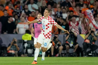 Croatia's Mario Pasalic celebrates after scoring his side's second goal during the Nations League semifinal soccer match between the Netherlands and Croatia at De Kuip stadium in Rotterdam, Netherlands, Wednesday, June 14, 2023. (AP Photo/Peter Dejong)