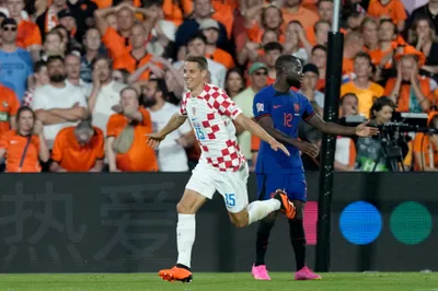 Croatia's Mario Pasalic celebrates after scoring his side's second goal during the Nations League semifinal soccer match between the Netherlands and Croatia at De Kuip stadium in Rotterdam, Netherlands, Wednesday, June 14, 2023. (AP Photo/Peter Dejong)