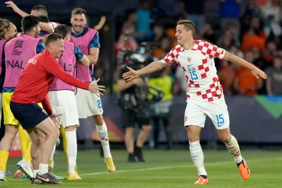 Croatia's Mario Pasalic celebrates after scoring his side's second goal during the Nations League semifinal soccer match between the Netherlands and Croatia at De Kuip stadium in Rotterdam, Netherlands, Wednesday, June 14, 2023. (AP Photo/Peter Dejong)