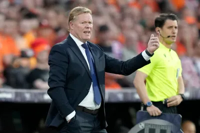 Netherlands coach Ronald Koeman gestures during the Nations League semifinal soccer match between the Netherlands and Croatia at De Kuip stadium in Rotterdam, Netherlands, Wednesday, June 14, 2023. (AP Photo/Peter Dejong)