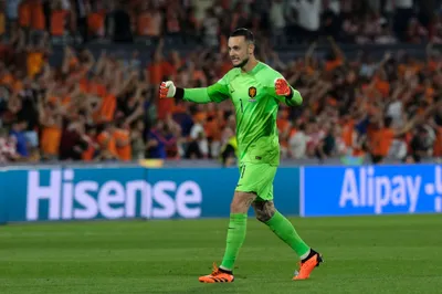 Netherlands goalkeeper Justin Bijlow celebrates after his teammate Noa Lang scoring against Croatia during the Nations League semifinal soccer match between the Netherlands and Croatia at De Kuip stadium in Rotterdam, Netherlands, Wednesday, June 14, 2023. (AP Photo/Patrick Post)