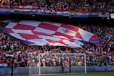 Croatia fans cheer on the stands during the Nations League semifinal soccer match between the Netherlands and Croatia at De Kuip stadium in Rotterdam, Netherlands, Wednesday, June 14, 2023. (AP Photo/Peter Dejong)