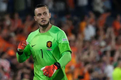 Netherlands goalkeeper Justin Bijlow celebrates after his teammate Noa Lang scoring against Croatia during the Nations League semifinal soccer match between the Netherlands and Croatia at De Kuip stadium in Rotterdam, Netherlands, Wednesday, June 14, 2023. (AP Photo/Patrick Post)