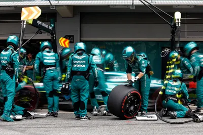 The tyres of the car of Aston Martin driver Fernando Alonso of Spain are changed during the Spanish Formula One Grand Prix at the Barcelona Catalunya racetrack in Montmelo, Spain, Sunday, June 4, 2023. (Albert Gea/Pool Photo via AP)

- f1autoz23