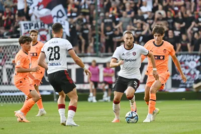 Na snímke zľava Martin Tejon, hráči Trnavy Martin Bukata, Filip Bainovič a hráč Valencie Fran Perez v zápase k oslavám storočnice Spartaka Trnava medzi FC Spartak Trnava a Valencia CF v Trnave v sobotu 22. júla 2023. FOTO TASR - Lukáš Grinaj

- SR Trnava Spartak šport futbal výročie oslava TTX
- Spartak Trnava  Valencia CF