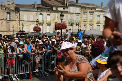 Spectators gather to watch the start of the eighth stage of the Tour de France cycling race over 201 kilometers (125 miles) with start in Libourne and finish in Limoges, France, Saturday, July 8, 2023. (AP Photo/Thibault Camus)