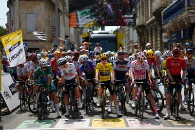 Denmark's Jonas Vingegaard, center, wearing the overall leader's yellow jersey, wait with other competitors to start the eighth stage of the Tour de France cycling race over 201 kilometers (125 miles) with start in Libourne and finish in Limoges, France, Saturday, July 8, 2023. (AP Photo/Thibault Camus)