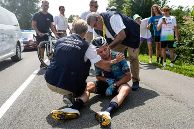Britain's Mark Cavendish receives medical assistance after crashing during the eighth stage of the Tour de France cycling race over 201 kilometers (125 miles) with start in Libourne and finish in Limoges, France, Saturday, July 8, 2023. (AP Photo/Thibault Camus)