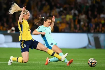 Australia's Hayley Raso, right, and Sweden's Amanda Ilestedt compete for the ball during the Women's World Cup third place playoff soccer match between Australia and Sweden in Brisbane, Australia, Saturday, Aug. 19, 2023. (AP Photo/Tertius Pickard)