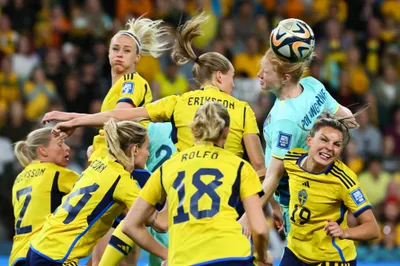 Australia's Clare Polkinghorne, top right, competes with Sweden's defenders to head the ball during the Women's World Cup third place playoff soccer match between Australia and Sweden in Brisbane, Australia, Saturday, Aug. 19, 2023. (AP Photo/Tertius Pickard)