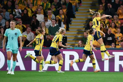 Sweden's Fridolina Rolfo, right, celebrates after scoring her team's first goal from the penalty spot during the Women's World Cup third place playoff soccer match between Australia and Sweden in Brisbane, Australia, Saturday, Aug. 19, 2023. (AP Photo/Tertius Pickard)