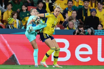 Australia's Steph Catley and Sweden's Fridolina Rolfo, right, compete for the ball during the Women's World Cup third place playoff soccer match between Australia and Sweden in Brisbane, Australia, Saturday, Aug. 19, 2023. (AP Photo/Tertius Pickard)