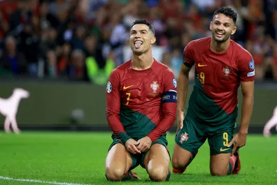 Portugal's Cristiano Ronaldo and Goncalo Ramos, right, react after a missed chance to score during the Euro 2024 group J qualifying soccer match between Portugal and Slovakia at the Dragao stadium in Porto, Portugal, Friday, Oct. 13, 2023. (AP Photo/Luis Vieira)

- XEURO2024X