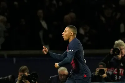 PSG's Kylian Mbappe celebrates after scoring his side's opening goal during the Champions League group F soccer match between Paris Saint Germain and AC Milan at Parc des Princes stadium in Paris, Wednesday, Oct. 25, 2023. (AP Photo/Thibault Camus)

- XCHAMPIONSLEAGUEX