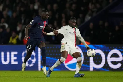 PSG's Randal Kolo Muani, left, challenges for the ball with AC Milan's Fikayo Tomori during the Champions League group F soccer match between Paris Saint Germain and AC Milan at Parc des Princes stadium in Paris, Wednesday, Oct. 25, 2023. (AP Photo/Thibault Camus)

- XCHAMPIONSLEAGUEX