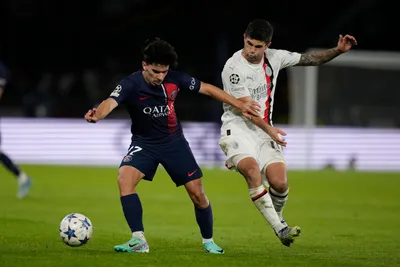 PSG's Vitinha, left, challenges for the ball with AC Milan's Christian Pulisic during the Champions League group F soccer match between Paris Saint Germain and AC Milan at Parc des Princes stadium in Paris, Wednesday, Oct. 25, 2023. (AP Photo/Thibault Camus)

- XCHAMPIONSLEAGUEX