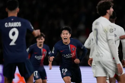 PSG's Lee Kang-in, centre, celebrates after scoring his side's third goal during the Champions League group F soccer match between Paris Saint Germain and AC Milan at Parc des Princes stadium in Paris, Wednesday, Oct. 25, 2023. (AP Photo/Thibault Camus)

- XCHAMPIONSLEAGUEX