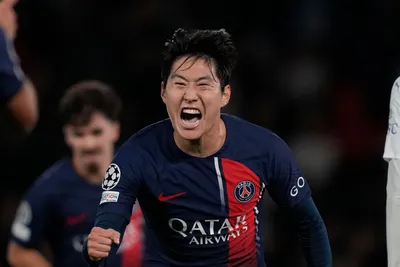 PSG's Lee Kang-in celebrates after scoring his side's third goal during the Champions League group F soccer match between Paris Saint Germain and AC Milan at Parc des Princes stadium in Paris, Wednesday, Oct. 25, 2023. (AP Photo/Thibault Camus)

- XCHAMPIONSLEAGUEX