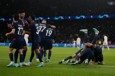 PSG's Lee Kang-in, fourth from right, celebrates with his teammates after scoring his side's third goal during the Champions League group F soccer match between Paris Saint Germain and AC Milan at Parc des Princes stadium in Paris, Wednesday, Oct. 25, 2023. (AP Photo/Thibault Camus)

- XCHAMPIONSLEAGUEX