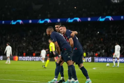 PSG's players celebrate after Lee Kang-in, scored his side's third goal during the Champions League group F soccer match between Paris Saint Germain and AC Milan at Parc des Princes stadium in Paris, Wednesday, Oct. 25, 2023. (AP Photo/Thibault Camus)

- XCHAMPIONSLEAGUEX
