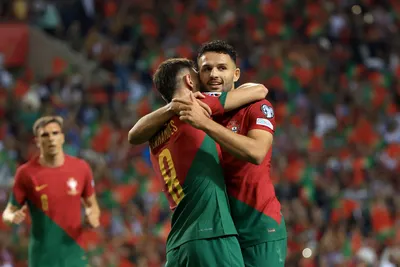 Portugal's Goncalo Ramos, right, celebrates with Bruno Fernandes after scoring the opening goal during the Euro 2024 group J qualifying soccer match between Portugal and Slovakia at the Dragao stadium in Porto, Portugal, Friday, Oct. 13, 2023. (AP Photo/Luis Vieira)

- XEURO2024X