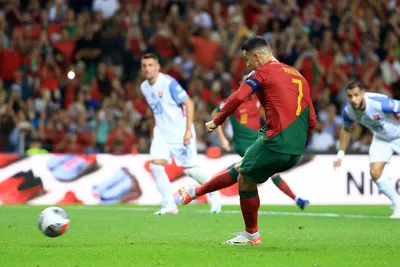 Portugal's Cristiano Ronaldo scores his side's second goal from the penalty spot during the Euro 2024 group J qualifying soccer match between Portugal and Slovakia at the Dragao stadium in Porto, Portugal, Friday, Oct. 13, 2023. (AP Photo/Luis Vieira)

- XEURO2024X