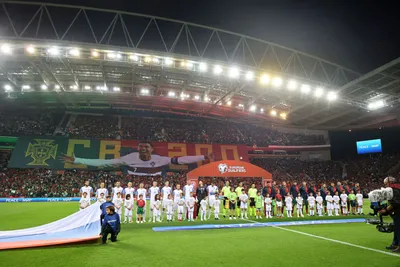 Portugal, right, and Slovakia players lineup before the Euro 2024 group J qualifying soccer match between Portugal and Slovakia at the Dragao stadium in Porto, Portugal, Friday, Oct. 13, 2023. (AP Photo/Luis Vieira)

- XEURO2024X
