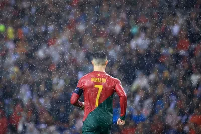 Portugal's Cristiano Ronaldo runs under a heavy rain during the Euro 2024 group J qualifying soccer match between Portugal and Slovakia at the Dragao stadium in Porto, Portugal, Friday, Oct. 13, 2023. (AP Photo/Luis Vieira)

- XEURO2024X
