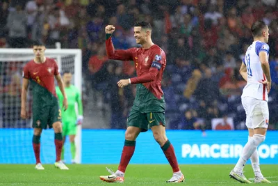 Portugal's Cristiano Ronaldo celebrates after scoring his side's third goal during the Euro 2024 group J qualifying soccer match between Portugal and Slovakia at the Dragao stadium in Porto, Portugal, Friday, Oct. 13, 2023. (AP Photo/Luis Vieira)

- XEURO2024X