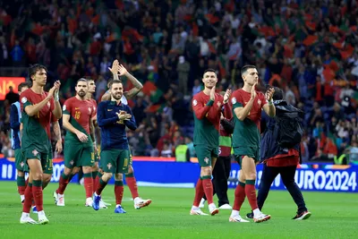 Portugal players celebrate at the end of the Euro 2024 group J qualifying soccer match between Portugal and Slovakia at the Dragao stadium in Porto, Portugal, Friday, Oct. 13, 2023. Portugal won 3-2 to qualify for the Euro 2024 championship in Germany. (AP Photo/Luis Vieira)

- XEURO2024X