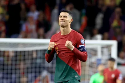 Portugal's Cristiano Ronaldo celebrates at the end of the Euro 2024 group J qualifying soccer match between Portugal and Slovakia at the Dragao stadium in Porto, Portugal, Friday, Oct. 13, 2023. Portugal won 3-2 to qualify for the Euro 2024 championship in Germany. (AP Photo/Luis Vieira)

- XEURO2024X