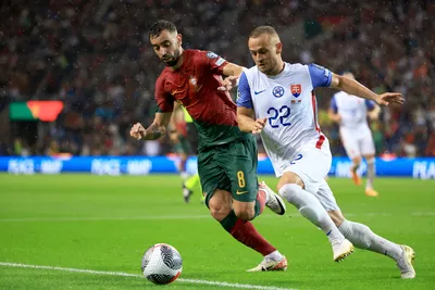 Portugal's Bruno Fernandes vies for the ball with Slovakia's Stanislav Lobotka, right, during the Euro 2024 group J qualifying soccer match between Portugal and Slovakia at the Dragao stadium in Porto, Portugal, Friday, Oct. 13, 2023. (AP Photo/Luis Vieira)

- XEURO2024X