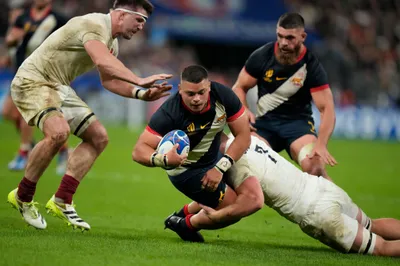 Argentina's Thomas Gallo is tackled by England's Sam Underhill during the Rugby World Cup third place match between England and Argentina at the Stade de France in Saint-Denis, outside Paris, Friday, Oct. 27, 2023. (AP Photo/Themba Hadebe)