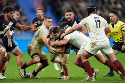 Argentina's Mateo Carreras, center, challenges for the ball during the Rugby World Cup third place match between England and Argentina at the Stade de France in Saint-Denis, outside Paris, Friday, Oct. 27, 2023. (AP Photo/Pavel Golovkin)