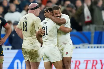 England's players celebrate after the Rugby World Cup third place match between England and Argentina at the Stade de France in Saint-Denis, outside Paris, Friday, Oct. 27, 2023. (AP Photo/Pavel Golovkin)