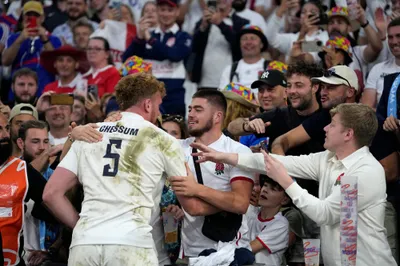 England's players celebrate at the end of the Rugby World Cup quarterfinal match between England and Fiji at the Stade de Marseille in Marseille, France, Sunday, Oct. 15, 2023. (AP Photo/Pavel Golovkin)