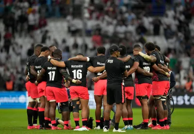 Fiji's players hug at the end of the Rugby World Cup quarterfinal match between England and Fiji at the Stade de Marseille in Marseille, France, Sunday, Oct. 15, 2023. (AP Photo/Pavel Golovkin)