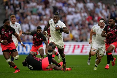 England's Maro Itoje runs with the ball during the Rugby World Cup quarterfinal match between England and Fiji at the Stade de Marseille in Marseille, France, Sunday, Oct. 15, 2023. (AP Photo/Daniel Cole)