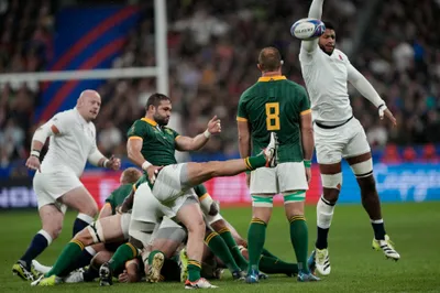 South Africa's Cobus Reinach kicks the ball during the Rugby World Cup semifinal match between England and South Africa at the Stade de France in Saint-Denis, outside Paris, Saturday, Oct. 21, 2023. (AP Photo/Lewis Joly)