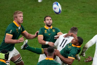 South Africa's Damian Willemse, right looks up after failing to catch the ball under pressure from England's Elliot Daly during the Rugby World Cup semifinal match between England and South Africa at the Stade de France in Saint-Denis, outside Paris, Saturday, Oct, 21, 2023. (AP Photo/Themba Hadebe)