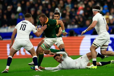 South Africa's Duane Vermeulen, center, challenges for the ball with England's Owen Farrell, left, and his teammate Alex Mitchell during the Rugby World Cup semifinal match between England and South Africa at the Stade de France in Saint-Denis, near Paris, Saturday, Oct. 21, 2023. (AP Photo/Aurelien Morissard)