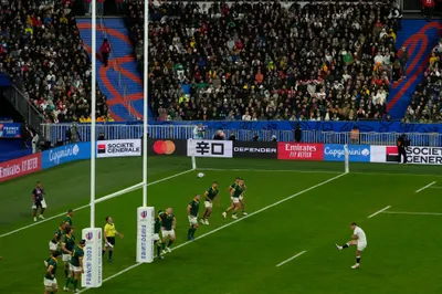 England's Owen Farrell, right, kicks and scores a penalty during the Rugby World Cup semifinal match between England and South Africa at the Stade de France in Saint-Denis, outside Paris, Saturday, Oct, 21, 2023. (AP Photo/Themba Hadebe)