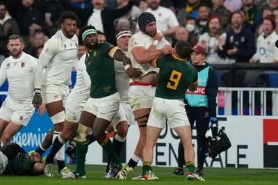 England's George Martin and South Africa's Cobus Reinach, right, scuffle during the Rugby World Cup semifinal match between England and South Africa at the Stade de France in Saint-Denis, outside Paris, Saturday, Oct.21, 2023. (AP Photo/Thibault Camus)