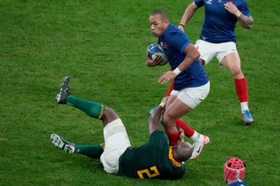 France's Gael Fickou, cntre, challenges for the ball during the Rugby World Cup quarterfinal match between France and South Africa at the Stade de France in Saint-Denis, near Paris, Sunday, Oct. 15, 2023. (AP Photo/Themba Hadebe)