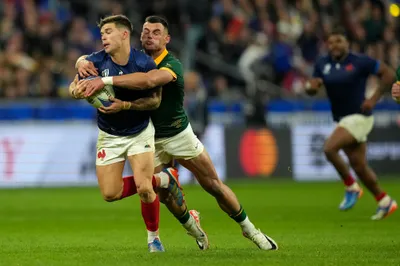 France's Matthieu Jalibert is tackled by South Africa's Jesse Kriel during the Rugby World Cup quarterfinal match between France and South Africa at the Stade de France in Saint-Denis, near Paris Sunday, Oct. 15, 2023. (AP Photo/Thibault Camus)