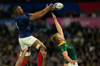 France's Cameron Woki, left, and South Africa's Pieter-Steph du Toit battle for the line out during the Rugby World Cup quarterfinal match between France and South Africa at the Stade de France in Saint-Denis, near Paris Sunday, Oct. 15, 2023. (AP Photo/Thibault Camus)