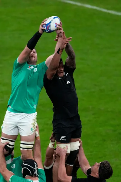 Ireland's Peter O'Mahony, left, wins a line out against New Zealand's Shannon Frizell during the Rugby World Cup quarterfinal match between Ireland and New Zealand at the Stade de France in Saint-Denis, near Paris Saturday, Oct. 14, 2023. (AP Photo/Themba Hadebe)