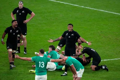 New Zealand's players celebrates after winning the Rugby World Cup quarterfinal match between Ireland and New Zealand at the Stade de France in Saint-Denis, near Paris, Saturday, Oct. 14, 2023. (AP Photo/Themba Hadebe)